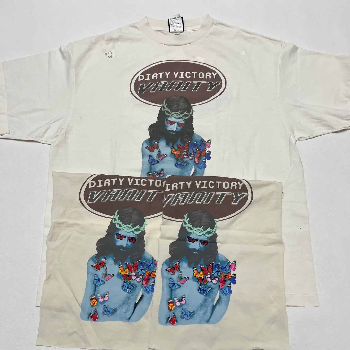 Printing proofing SAINT Mxxxxxx VANITY SS TEE/WHT Jesus butterfly printed short-sleeved off-white S-XL cylindrical fabric without side seams 220g high weight OE yarn ⚠️Note: It is almost meaningless if it is not a cylindrical fabric Customized main mark/wash mark/little angel anti-counterfeiting label Original-level printing factory Top purchasing level